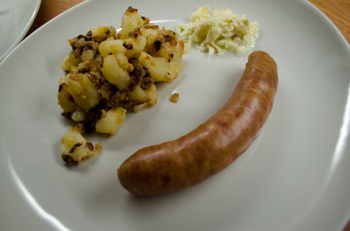 Kranjska sausage and sautéed potatoes