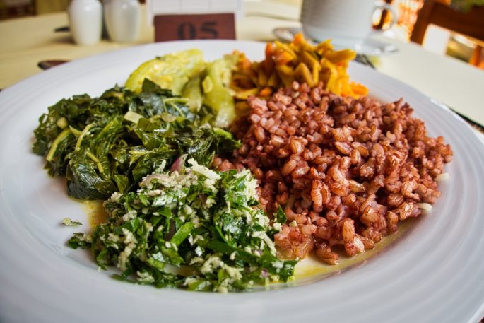 Plate of red rice and healthy ayurvedic salads at Barberyn Sands Resort, Sri Lanka