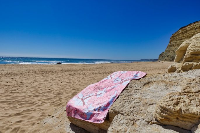 Tesalate towel on rocks