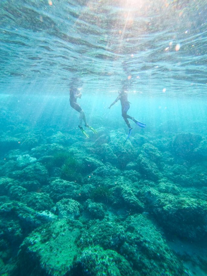 two snorkelers underwater